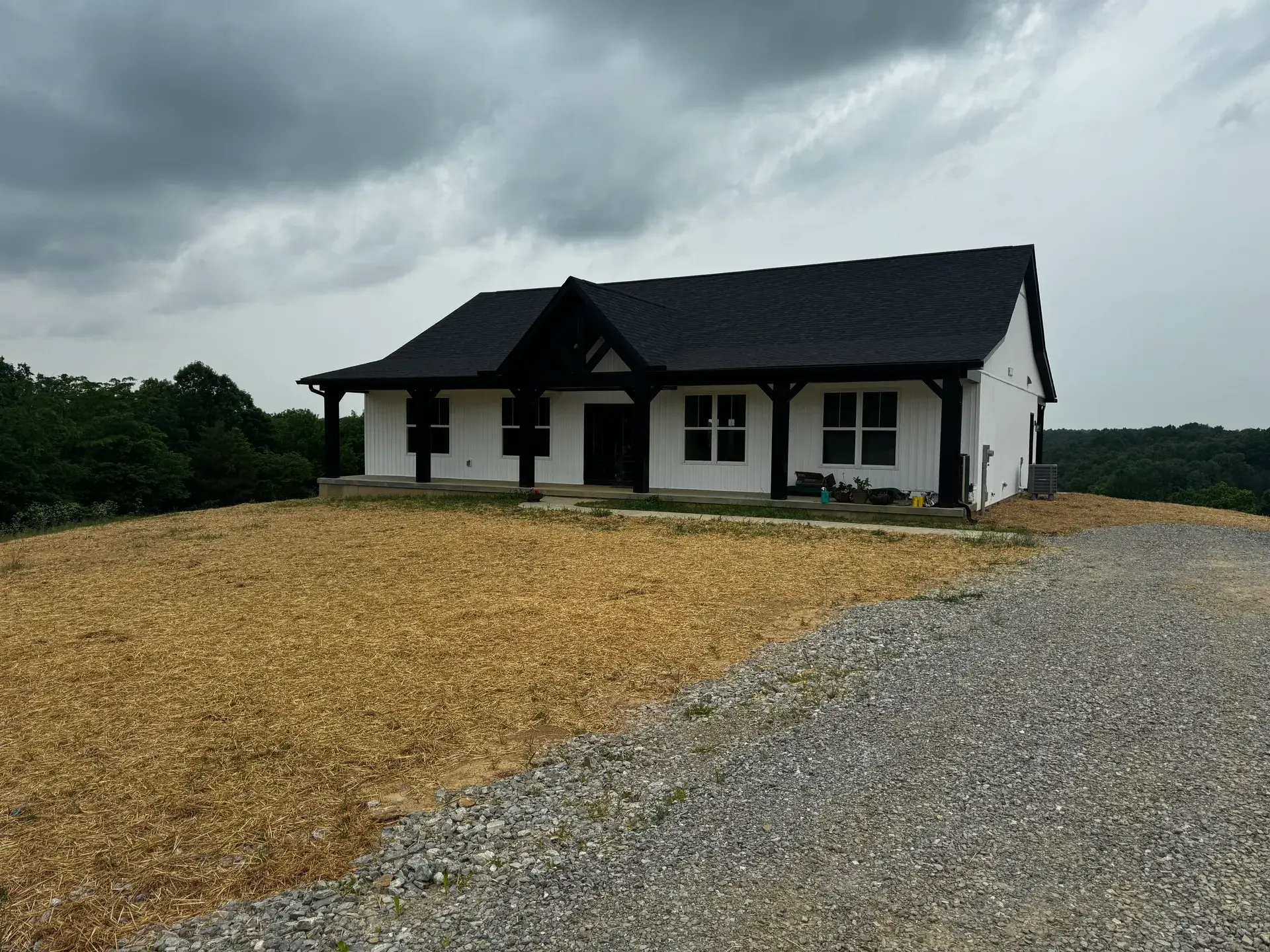 Modern farmhouse new home build with covered timber porch